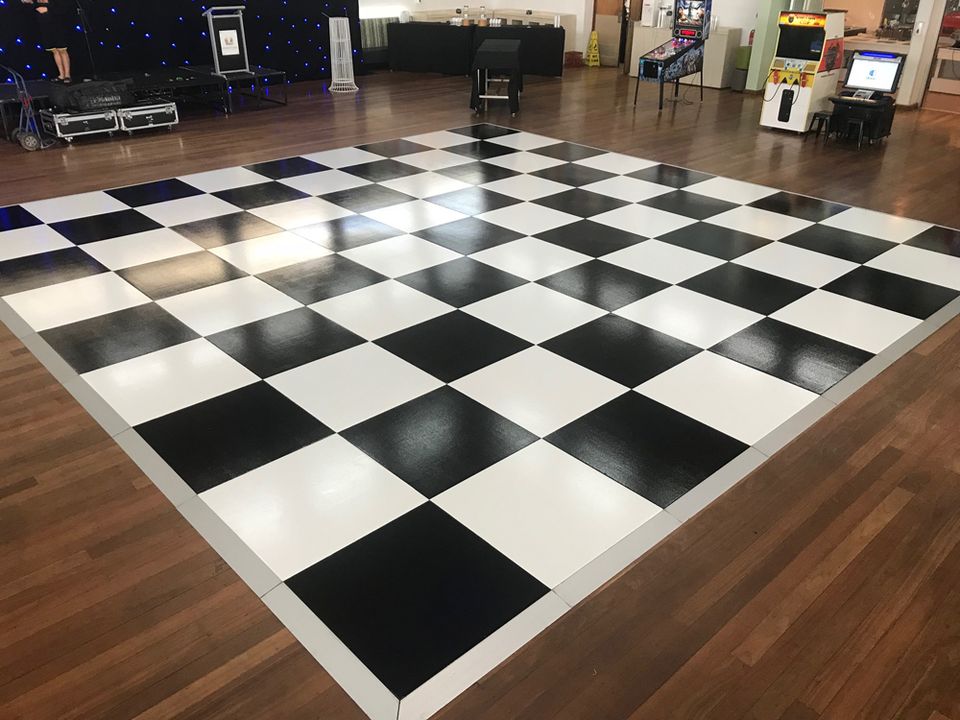 Black and White Check dance floor in a timber-floored hall