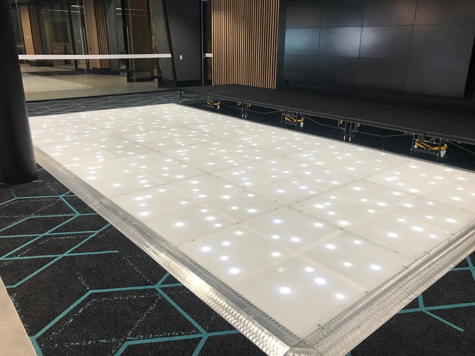 LED starlight dance floor with white twinkling lights in a function room