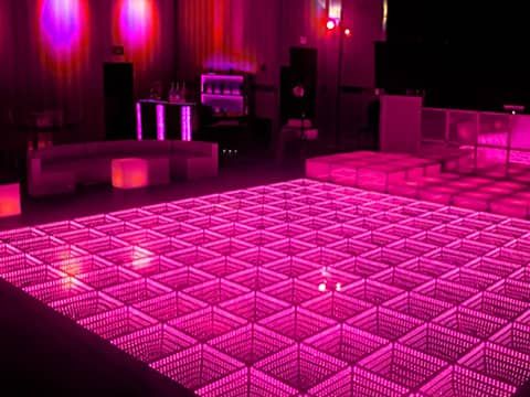 LED Infinity dance floor glowing pink with a deep tunnel effect